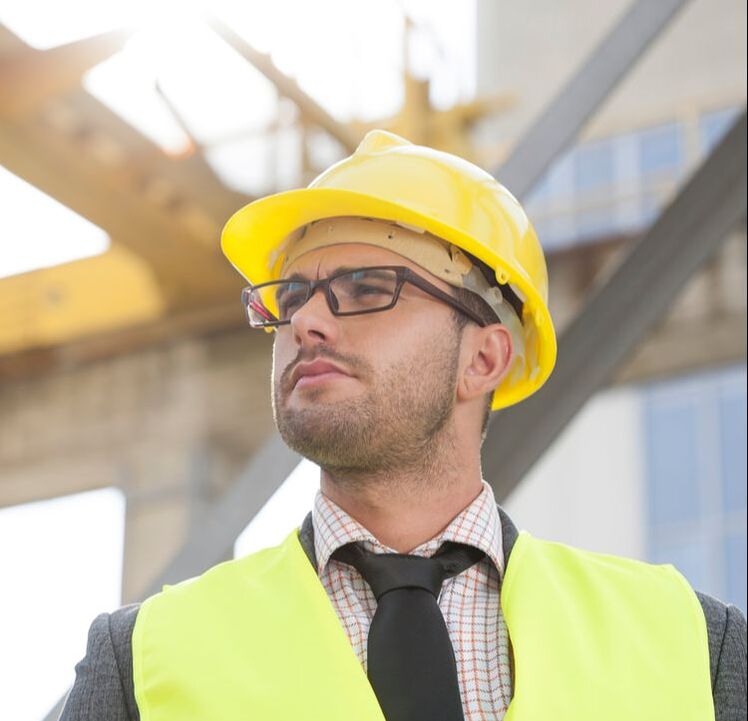 Guy with prescription safety glasses at construction site