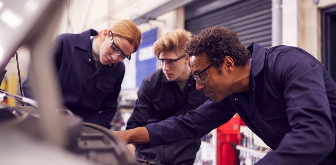 Auto Mechanics looking at engine - OSHA and ANSI - The Standard for Safety Glasses