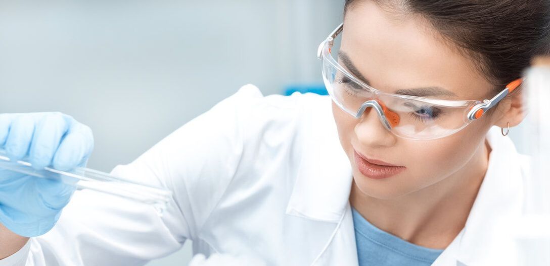 Female lab worker with safety glasses | What Are Some of the Current Trends in Safety Eyewear?